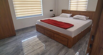 POOZHIKUTH RESIDENCY Room Type - Deluxe Double Room