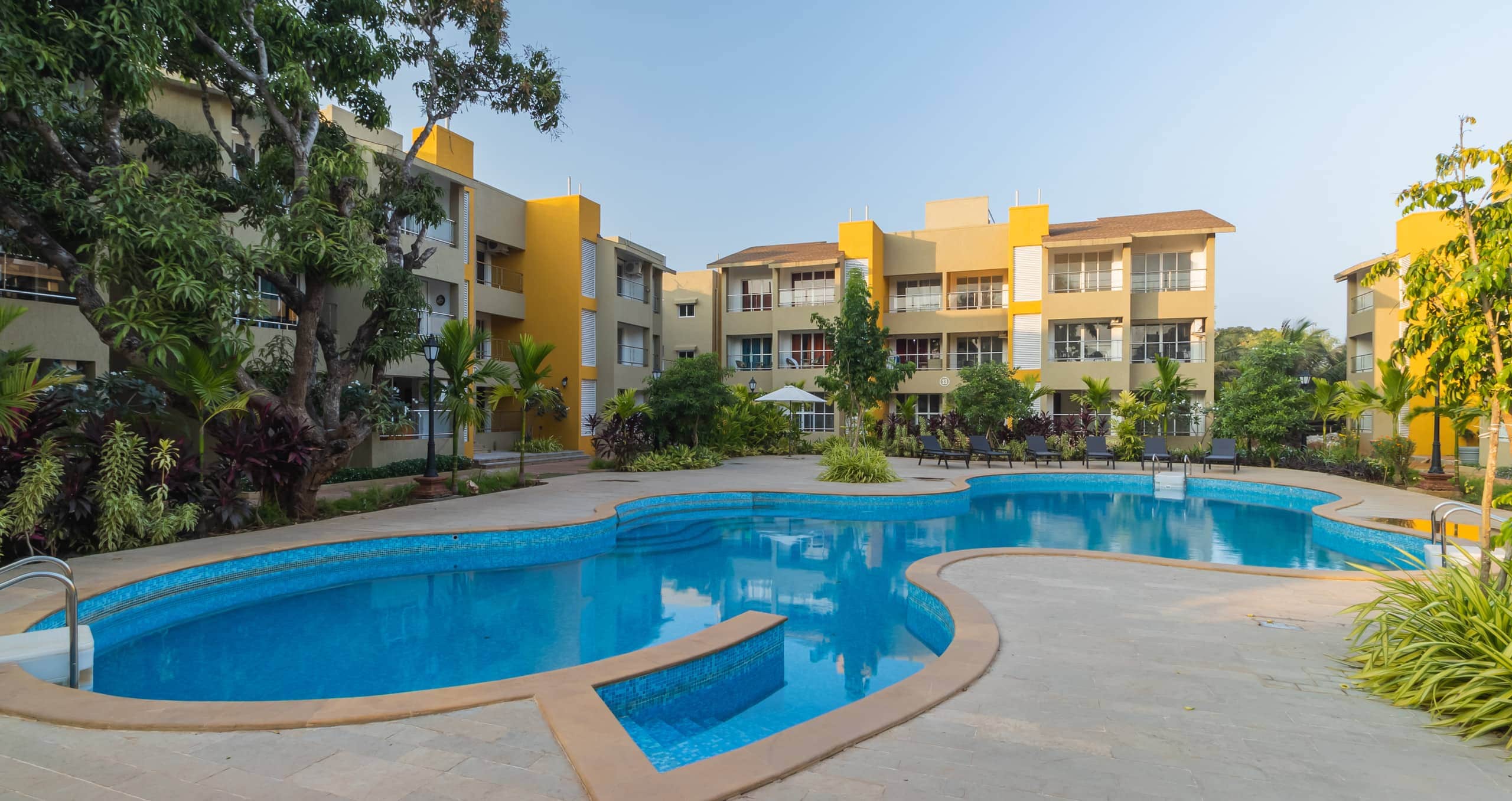 1BHK Room Common Pool Charvi - Tap to explore photos