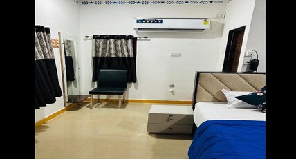 Pooja Hotel and Guest House Room Type - Deluxe AC Room