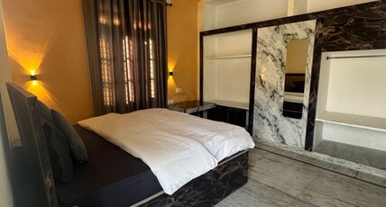 BHAGIRATHI RESIDENCY Room Type - Deluxe Room with Mountain View