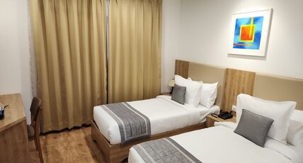 Oasis Suites Room Type - Deluxe Twin AC Room