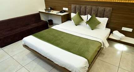 Hotel Govindam Room Type - DELUXE  STANDARD AC ROOM