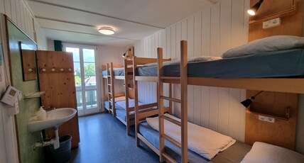 Backpackers Villa Sonnenhof - Hostel Interlaken Room Type - Eco Quad Room - 2 Bunk Beds