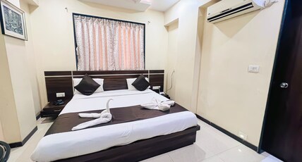 Aarya Regency Room Type - Deluxe AC Room