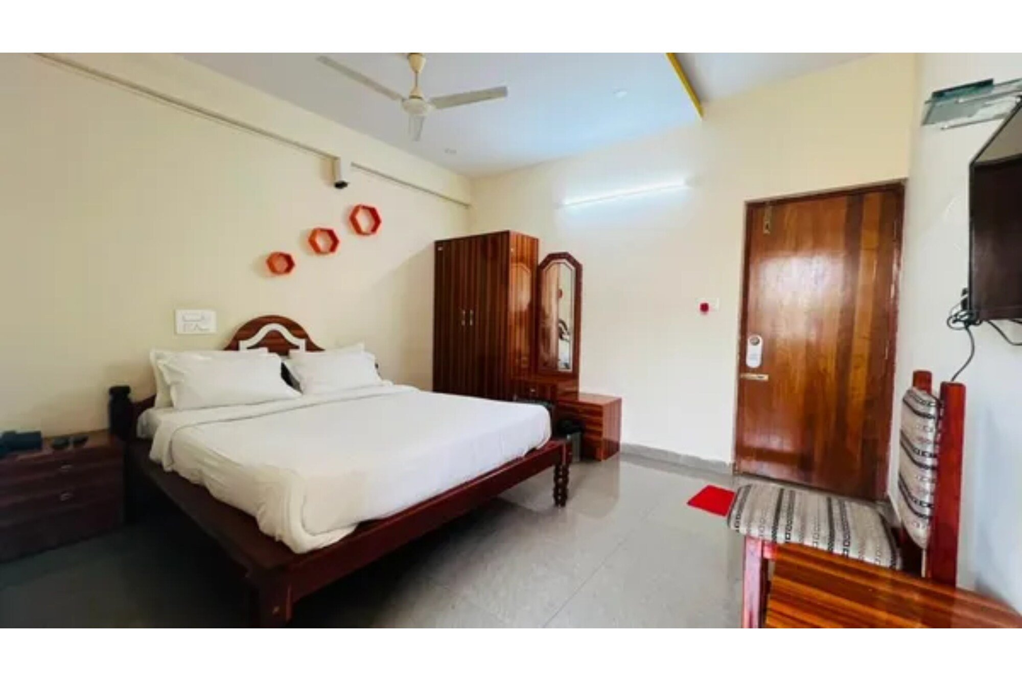 FabHotel Sangama Comfort - Tap to explore photos