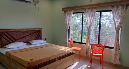 SHIVOHAM HOME STAY Room Type - Deluxe Room AC