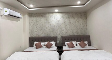 HOTEL J P FARM Room Type - FAMILY ROOM (Two Double Bed & 1 double bed with single Bed)