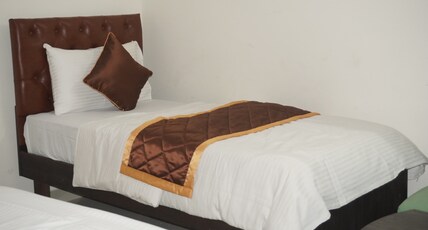 BRINDAVANA STAY Room Type - DELUXE ROOM