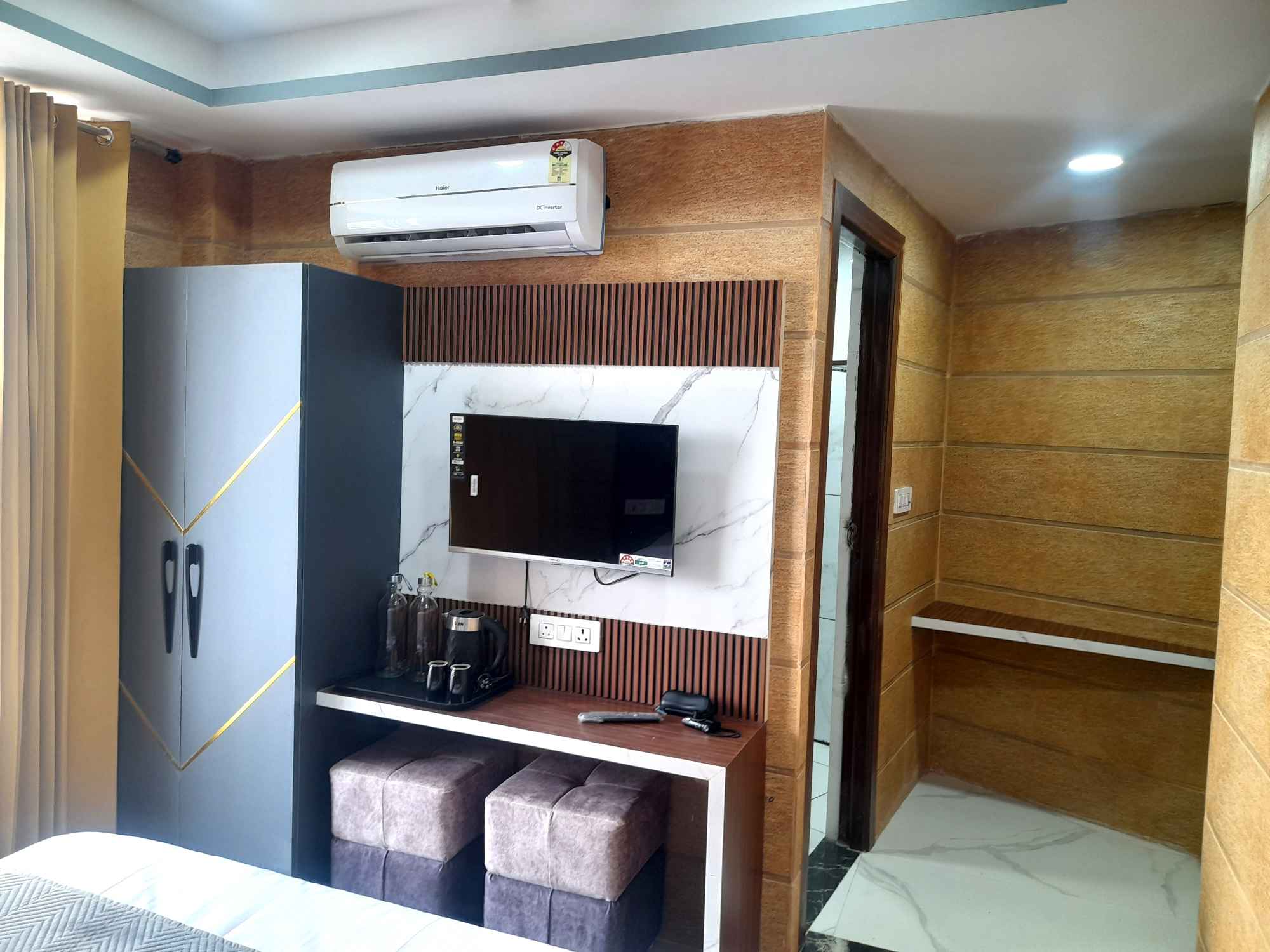 Hotel Asha Delight - Tap to explore photos