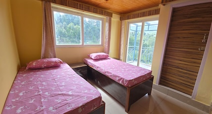 Tapas   Peaceful Hillside Stay Room Type - Bed room with twin bed, Balcony and attached toilet with jungle view