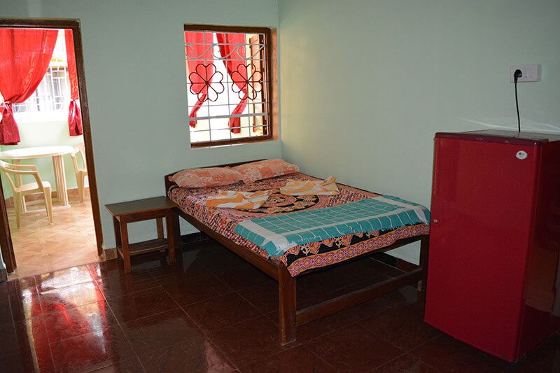 Vailankanni Guesthouse | Rooms & Kitchen - Tap to explore photos