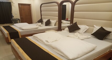 M JAC INTERNATIONAL Room Type - AC Deluxe Room Four Bed With Balcony