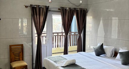 Nest inn Room Type - Deluxe King Bed Room with Balcony