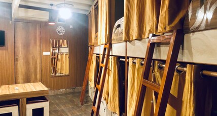 Nomad Guest House Room Type - Mixed Dorm |1 bed in 8 Bunk Bed AC Dorm | Shared Washrooms