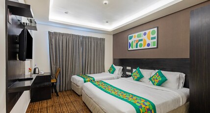 Treebo Premium Twin Star Room Type - Deluxe Family Room