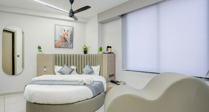 Hotel M H Grand Room Type - Round bed with S shape Couch Room