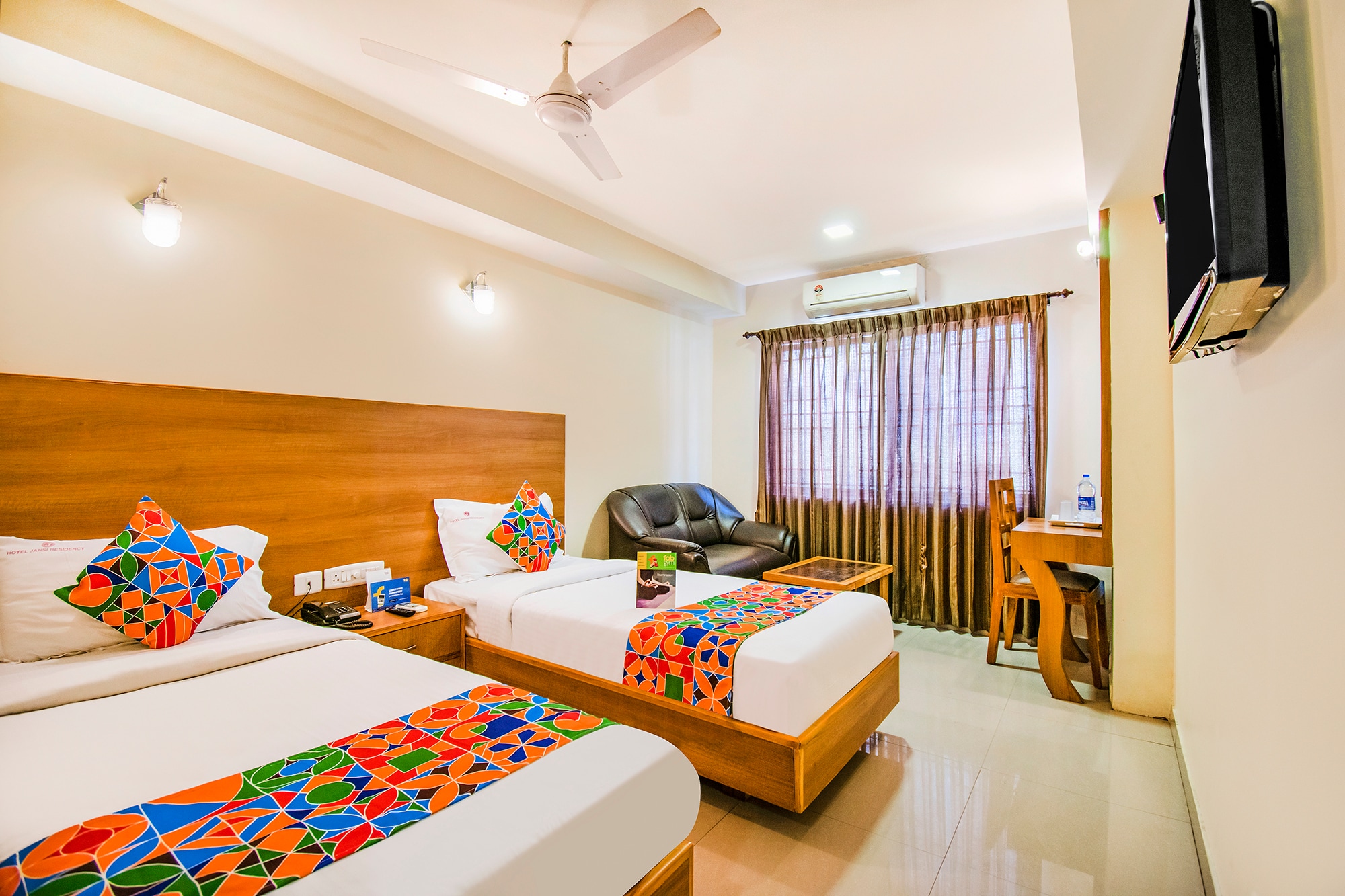 FabHotel Jansi Deluxe - Nr. Gandhipuram Bus Stand - Tap to explore photos