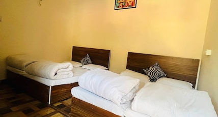Priya Hotel Room Type - Quad Sharing Family Deluxe Room