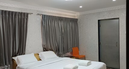 ARASAN RESIDENCY Room Type - DELUXE ROOM