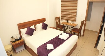 Pooram Tourist Home Room Type - Deluxe Rooms