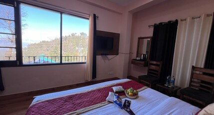 Hotel Canadian Cottage( Hot and Cold AC) Room Type - Premium room with forest view- Hot and Cold AC