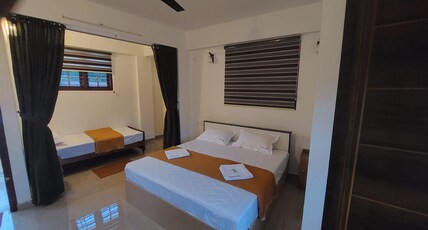 Karthika Homestay Room Type - King room with one single bed and one King bed