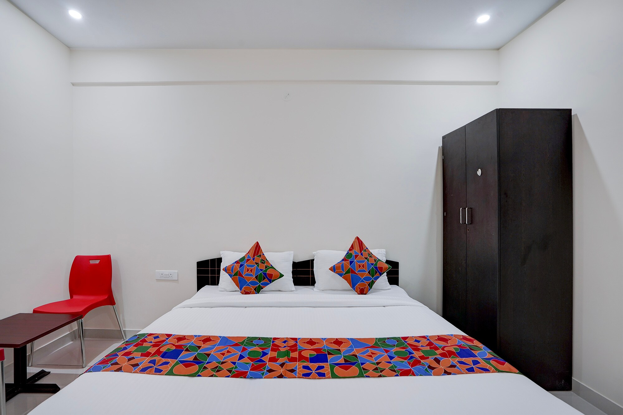 FabHotel Dwaraka Comfort - Tap to explore photos