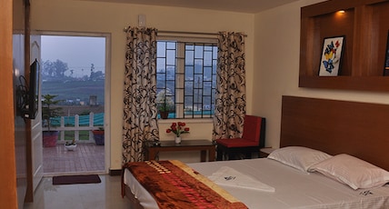 DrizzleDrop Inn Room Type - Deluxe Double Room with Balcony DrizzleDrop Inn Room Type - Deluxe Double Room with Balcony