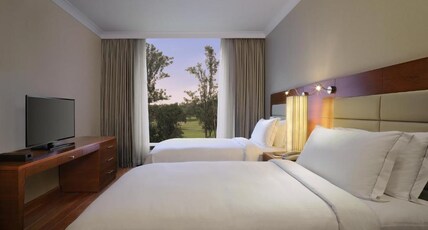 Hilton Bangalore Embassy GolfLinks Room Type - Two Bedroom Deluxe Suite with Kitchenette, Bathtub & Cocktail hours Hilton Bangalore Embassy GolfLinks Room Type - Two Bedroom Deluxe Suite with Kitchenette, Bathtub & Cocktail hours