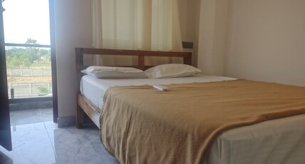 Orange and Grey Beach house Room Type - Double - AC with Balcony