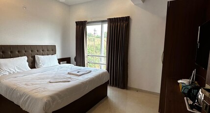 Breezy Cozzy Room Type - Deluxe AC Room