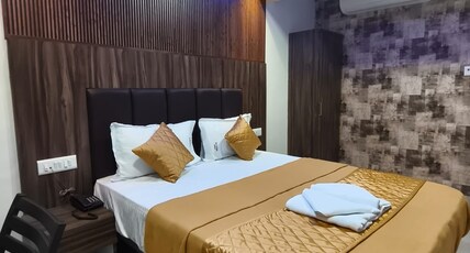 SAI SATKAR LODGING Room Type - Deluxe Room