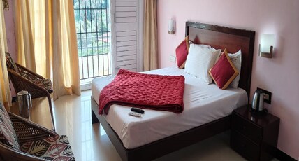 Ezhil Royal Stay Room Type - Deluxe Double Room with Balcony