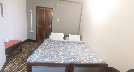 Hotel Sakura Mountain View | 5 mins from Darjeeling Railway Station Room Type - Standard Room Basement ( Non geyser Hot water will be provided in bucket)