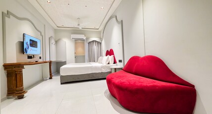 Hotel Nova Bloom Room Type - Premium Couple Suite with Lip Sofa & 43 Inch Smart Android T.V. for Netflix and Chill