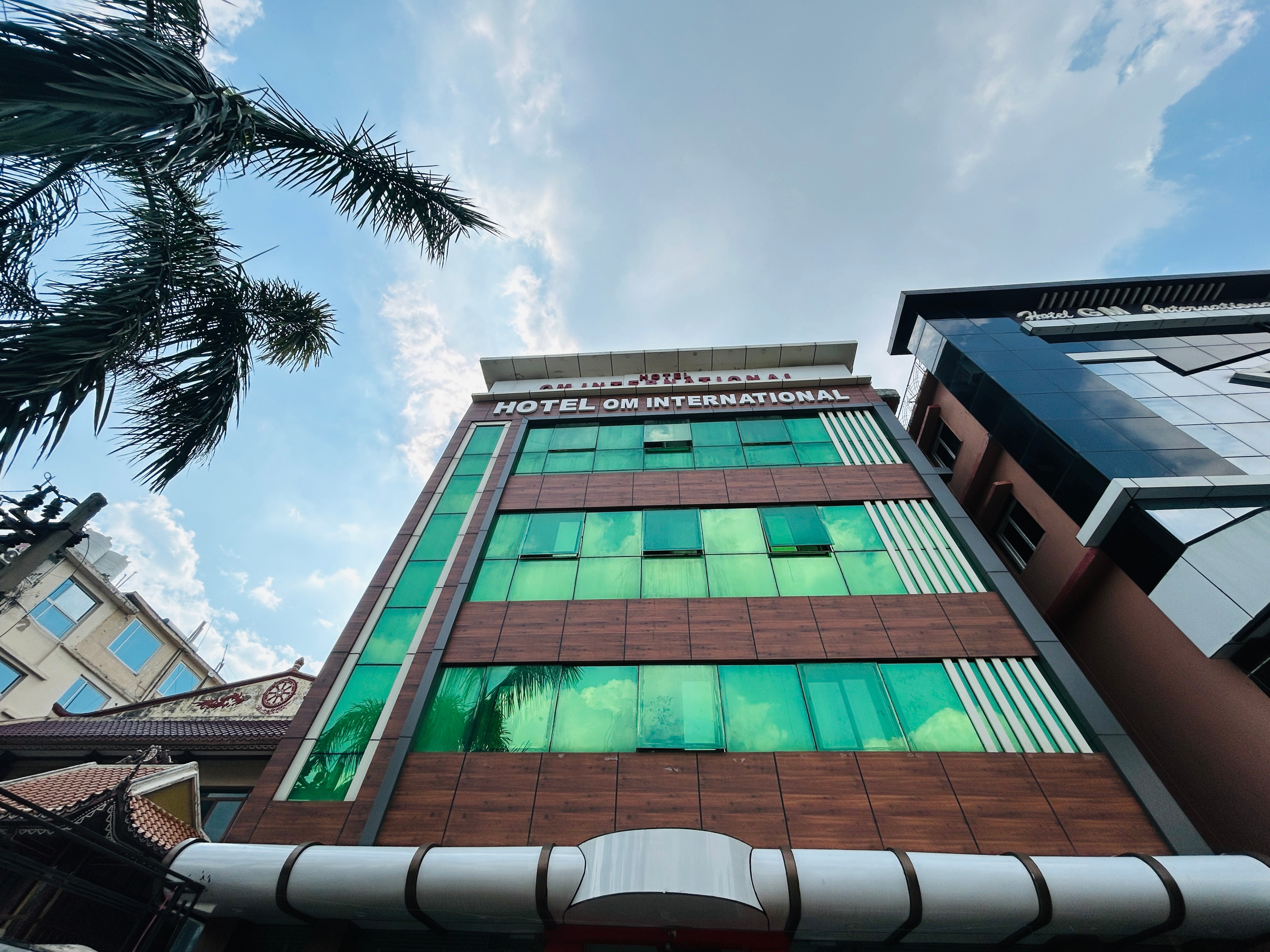 Hotel Om International - Tap to explore photos