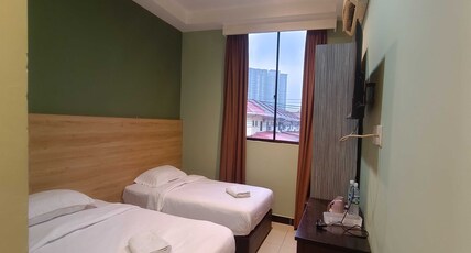 Hotel O Rainfield Inn Room Type - Deluxe Twin