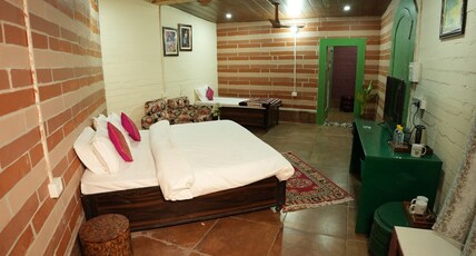 The Palm Bliss Resort Room Type - Cozy Swiss Cottage with Garden View. The Palm Bliss Resort Room Type - Cozy Swiss Cottage with Garden View.