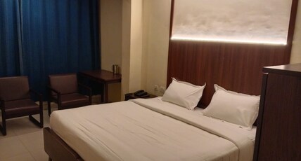Hotel Kurinji Room Type - Deluxe Room AC with Main Falls view Hotel Kurinji Room Type - Deluxe Room AC with Main Falls view
