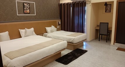 Hotel Tropical inn Room Type - Premium triple AC Room