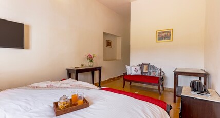 Palatial farm with pool and Breakfast Udaipur. Room Type - Bedroom 1