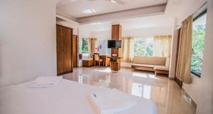 Mango Stayys | A Boutique Stay Room Type - Luxury Suite with Balcony ( Garden View )