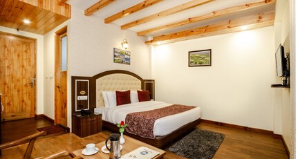 Snow Paradise - Pure Veg Hotel Room Type - Deluxe Room