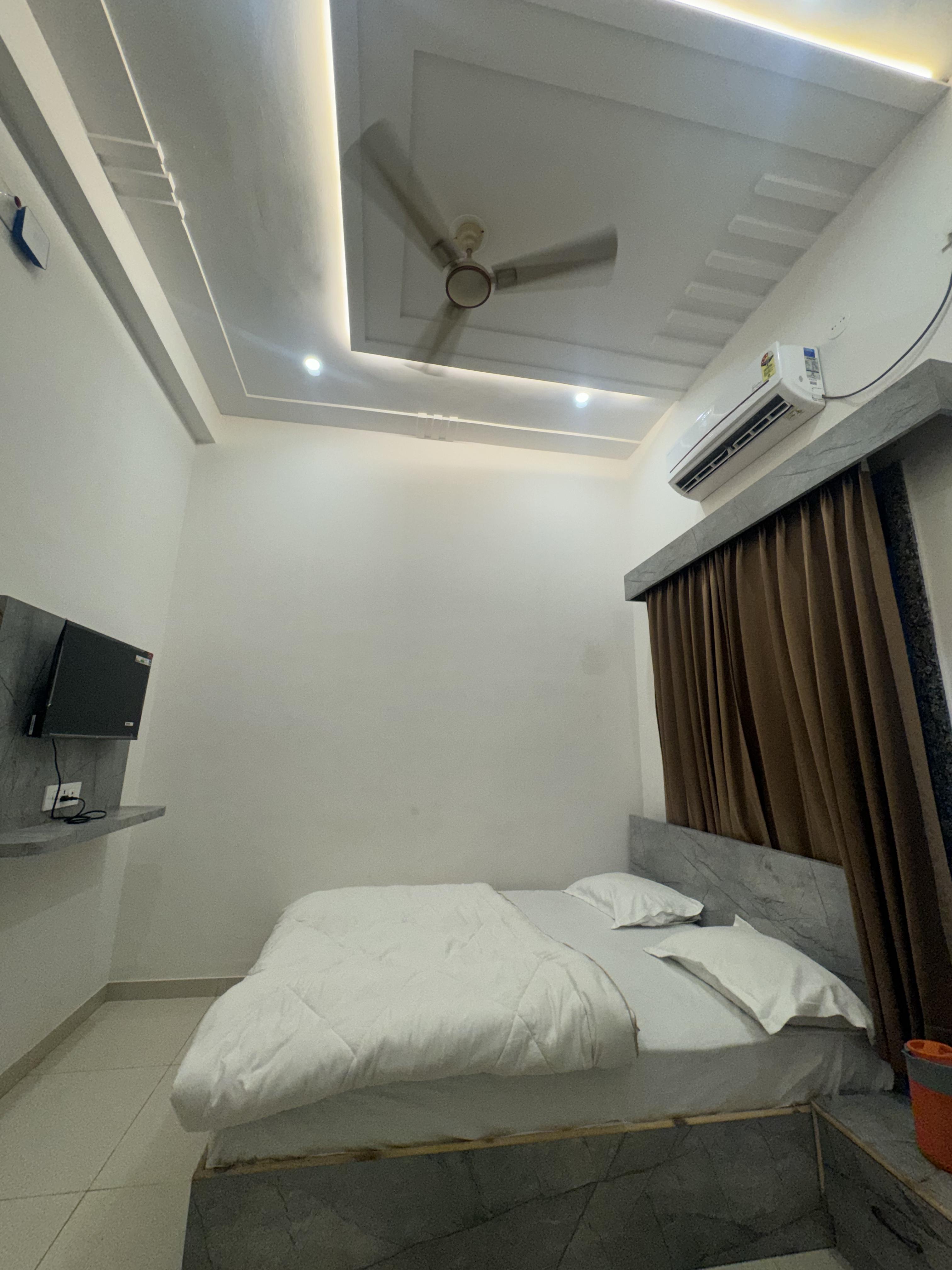 Pujari Guest House. - Tap to explore photos