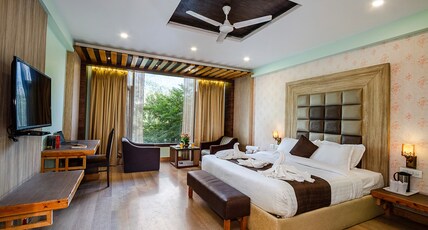 TRIBHAV Rohtang Heights ( A Mountain Resort with Rooftop Lounge & Apple Orchard Views ) Room Type - Premium Room - Hamta View and River View