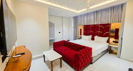 Hotel Nova Bloom Room Type - Premium Suite with chesterfield Sofa and 55 Inch Android Smart T.V. for Netflix and Chill