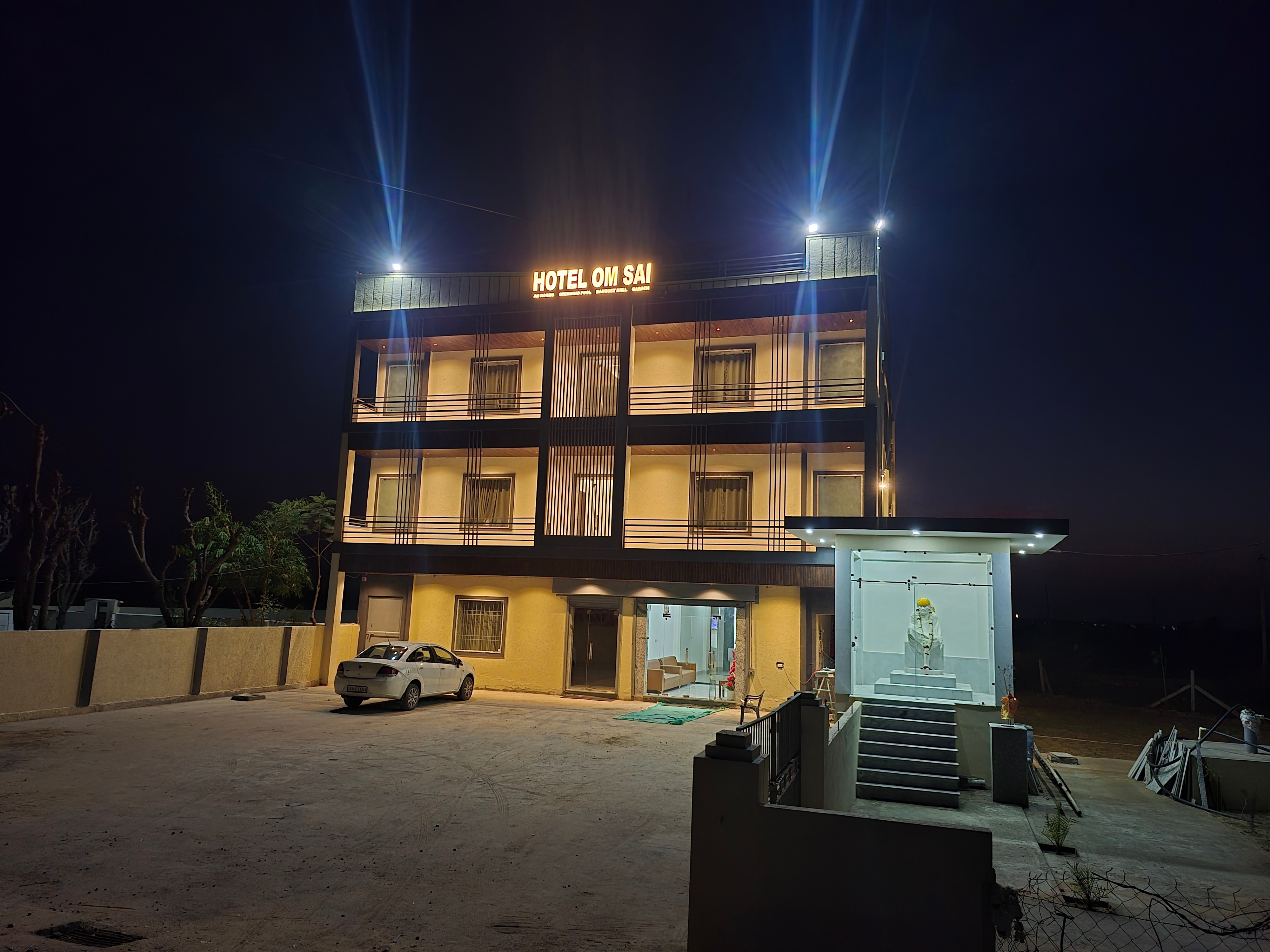 Hotel Om Sai - Tap to explore photos