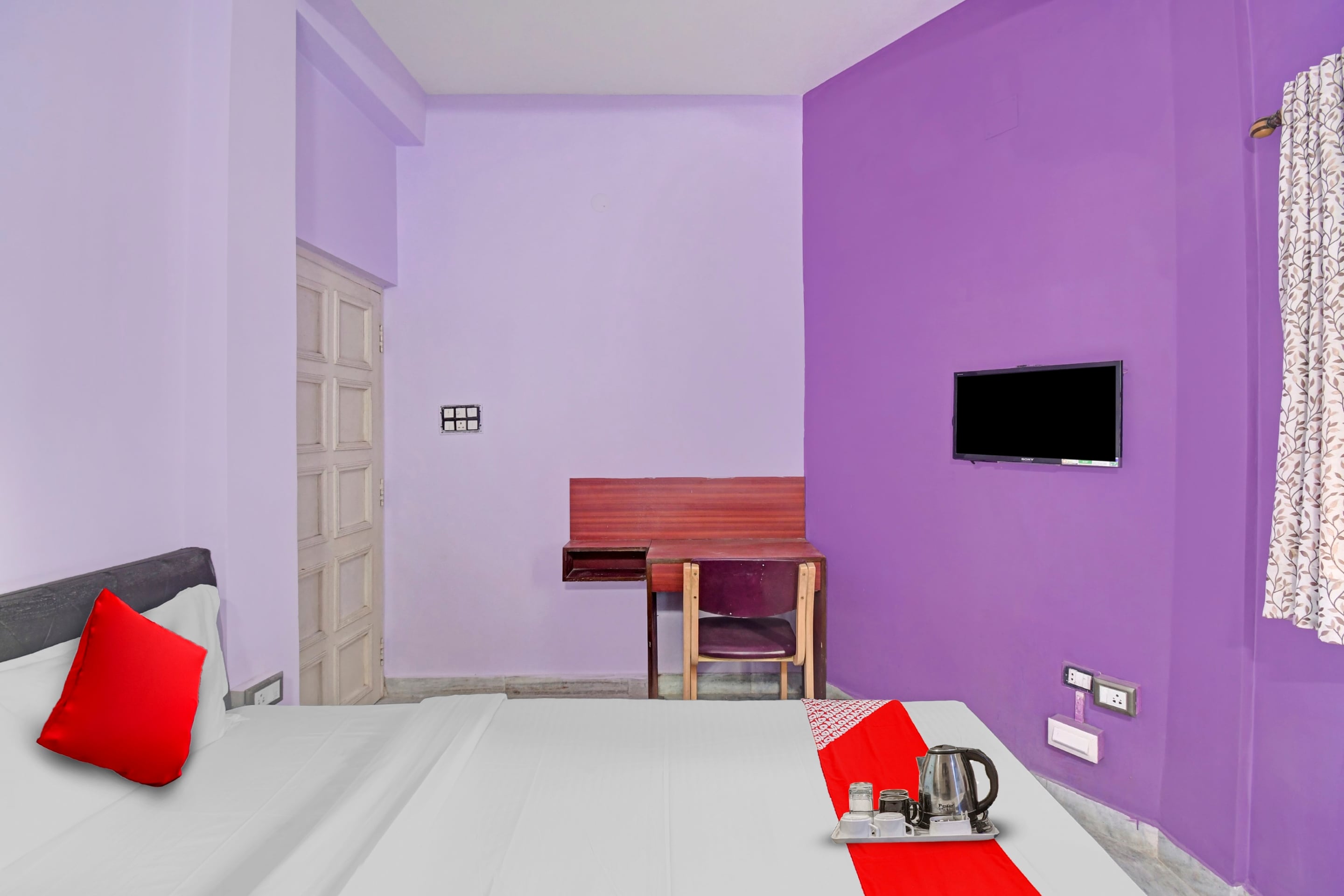 Hotel O R A Homestay Near Acropolis Mall - Tap to explore photos