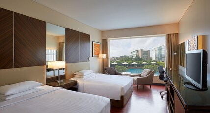 Courtyard by Marriott Mumbai International Airport Room Type - Deluxe Twin Room With Pool View Courtyard by Marriott Mumbai International Airport Room Type - Deluxe Twin Room With Pool View