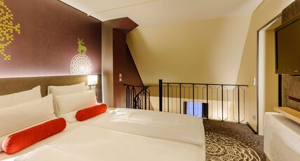Mercure Muenchen City Center Room Type - Privilege Room across two floors with a Queen-Size Bed